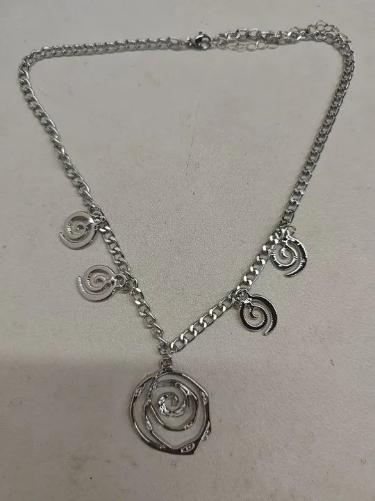 Spiral donut design alloy necklace, bracelet and earrings set in gold or silver electroplated finish.