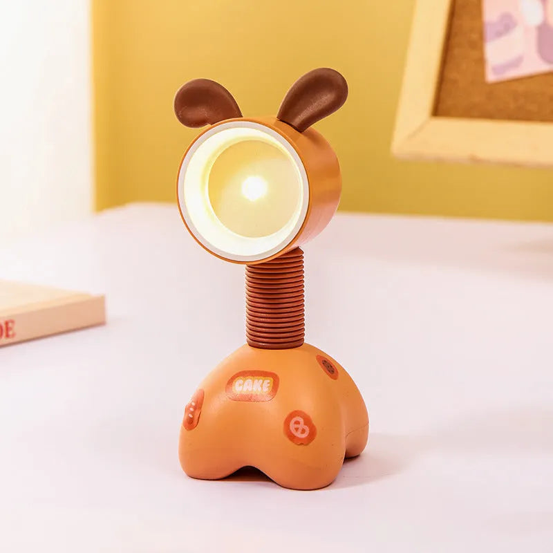 Cartoon animal magnetic night lamp with adjustable head on metallic surface