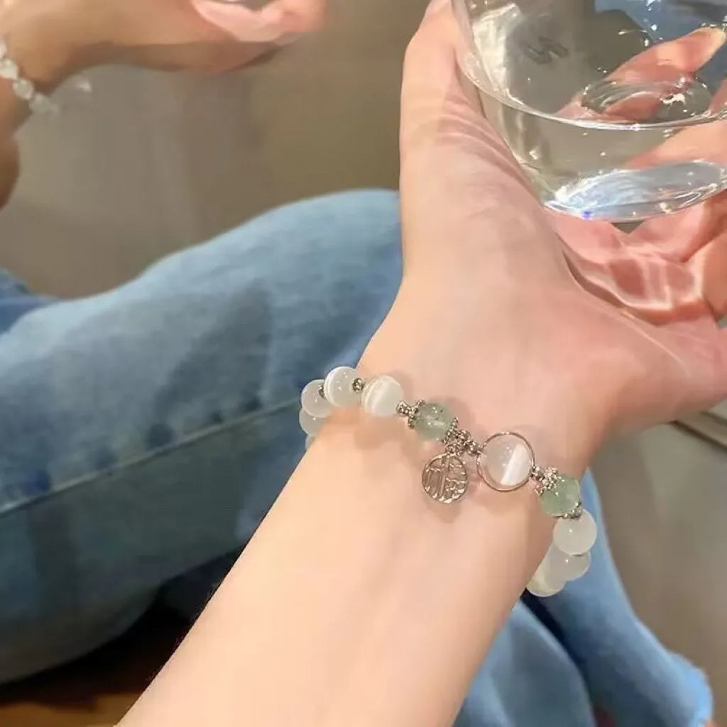 Women's glass butterfly bracelet with coloured glaze beads in drop shape design