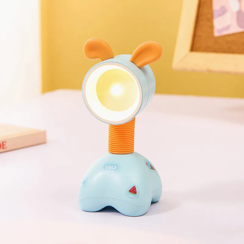 Cartoon animal magnetic night lamp with adjustable head on metallic surface