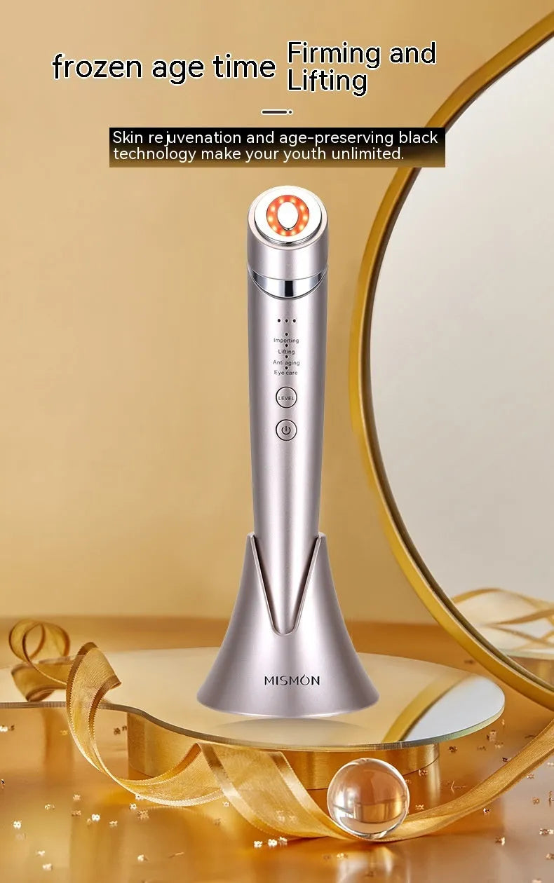 Pulse RF beauty instrument in mist blue held in hand, showing silicone head and control button