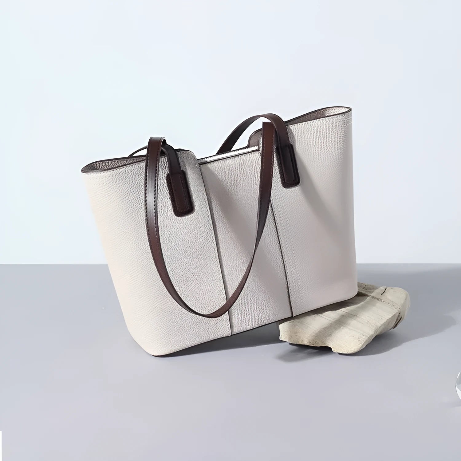 Women's genuine leather shoulder bag in khaki colour showing box-type design and organised interior compartments