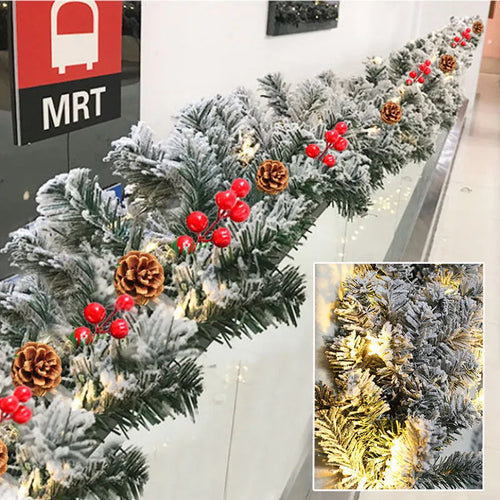 White flocked snow Christmas rattan vine decorative garland on green background
