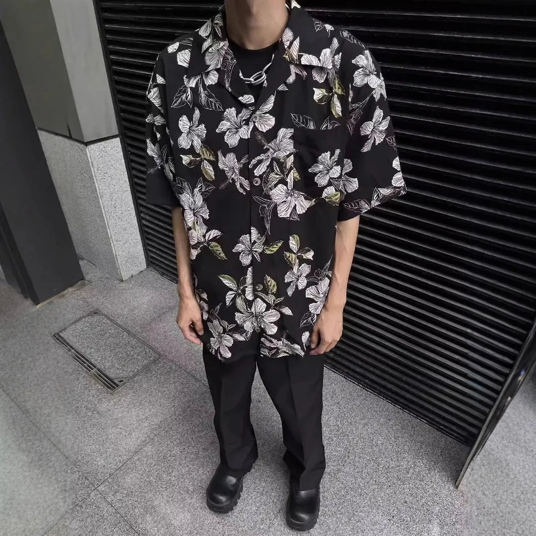Black men's short sleeve shirt with floral print, Cuban collar, and loose cardigan fit.