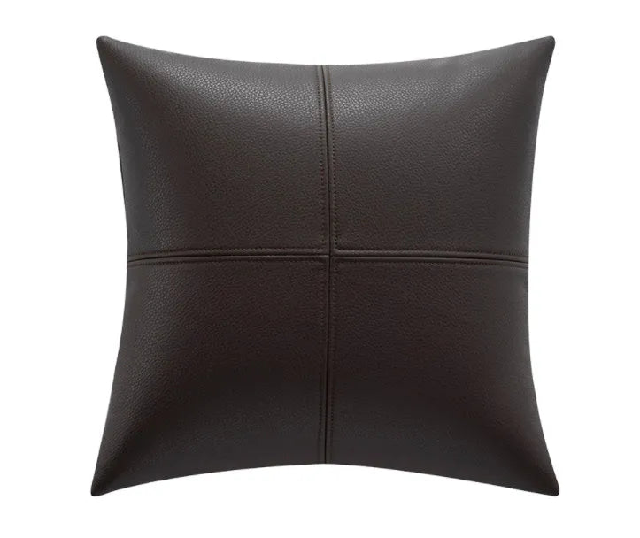 Soft cowhide leather pillow cover in a solid colour on a sofa.