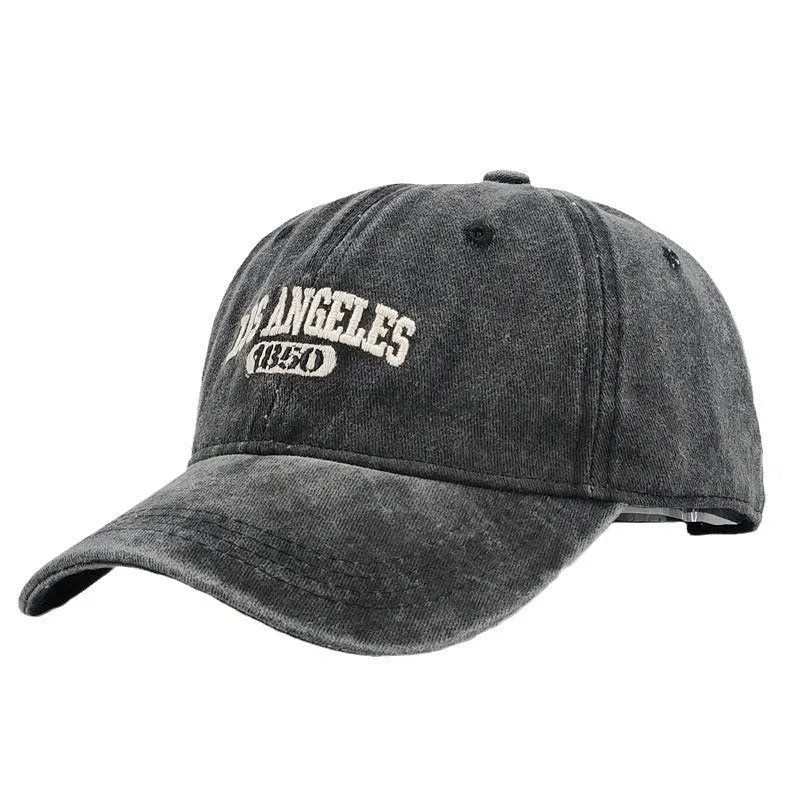 Retro-style personalised baseball cap with distressed letter embroidery on an adjustable strap, shown in beige colour.