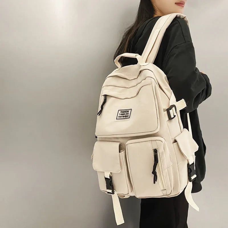 Black nylon student backpack showing laptop compartment and three-dimensional pockets