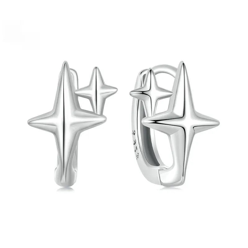 Minimalist star design sterling silver clip-on earring with XINGX motif.