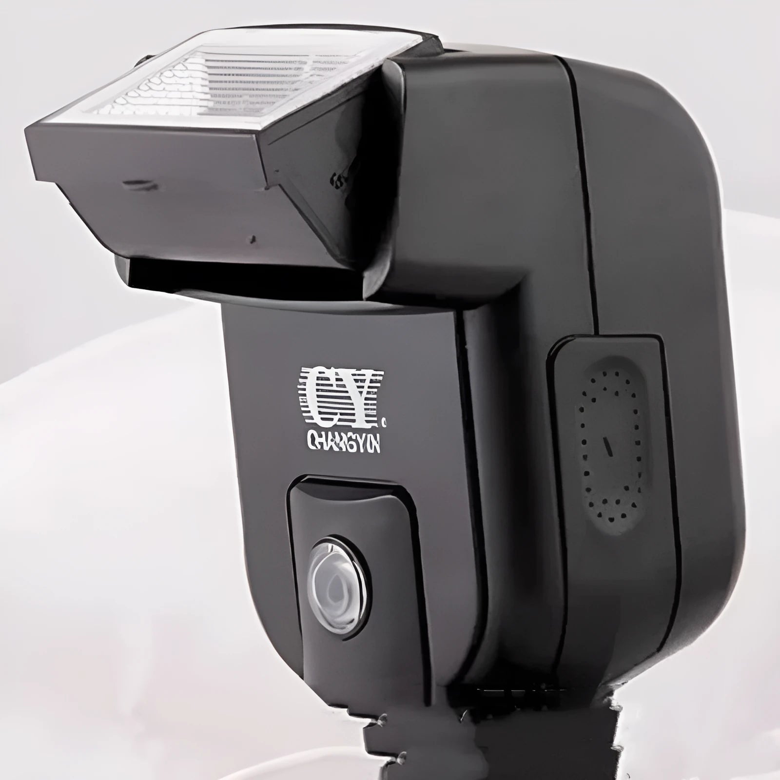 Compact SLR camera flash unit with 90-degree tilt adjustment shown mounted on camera