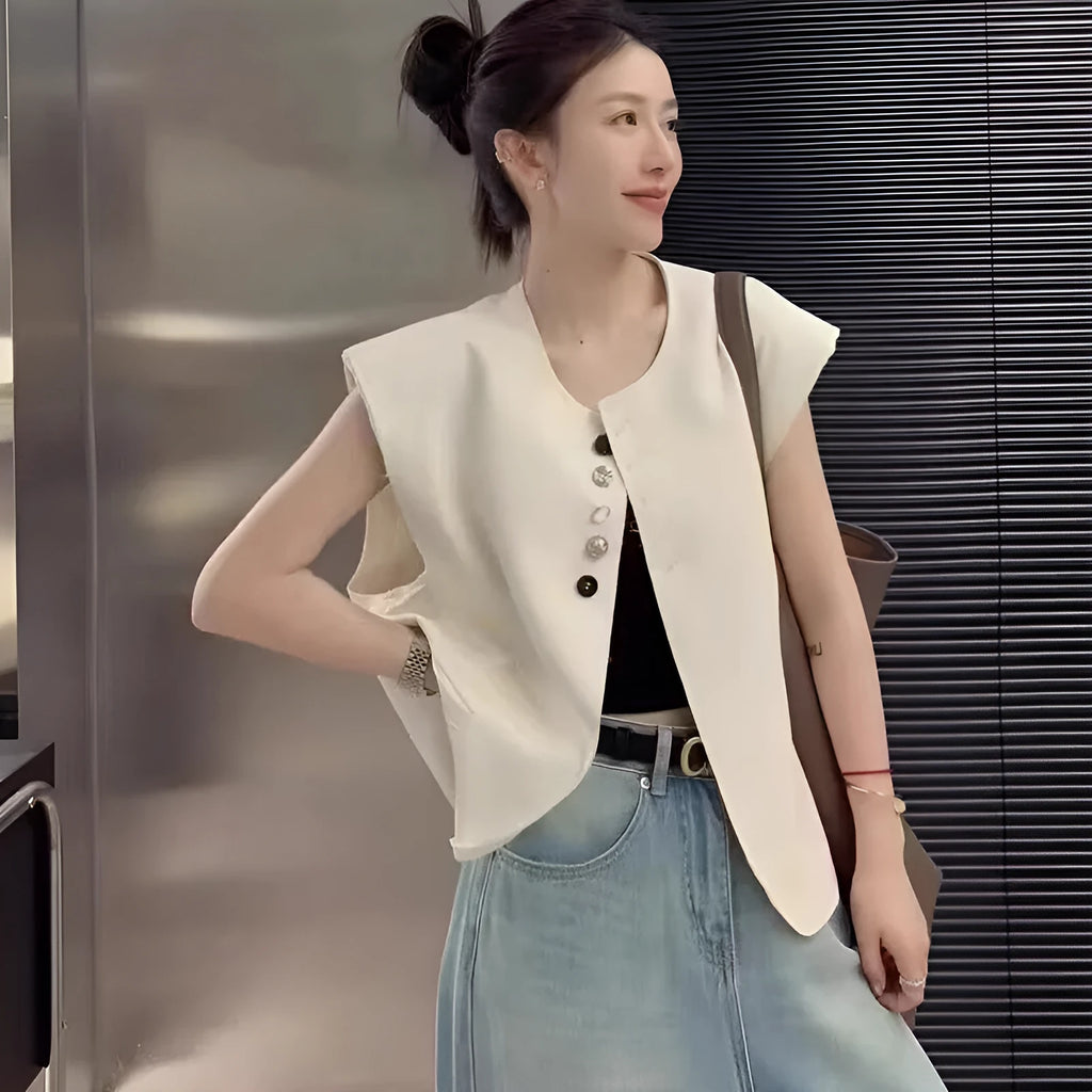 Women's loose fit polyester vest in milky white, featuring a short length and a front pocket.