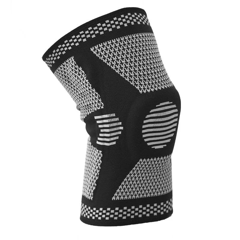 Green silicone spring knee pad for sports, showing polyamide construction and non-slip design on a leg.