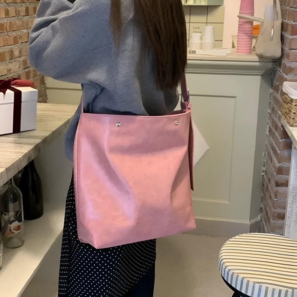 Pink corduroy one-shoulder commuter bag with dimensions 39cm by 32cm