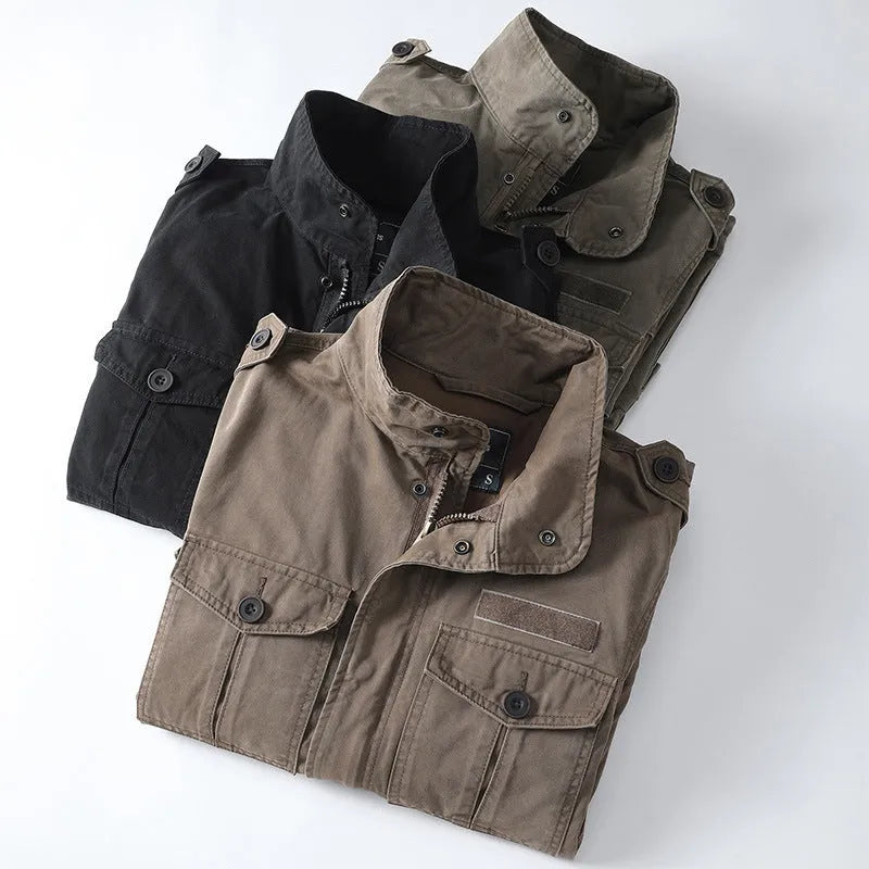 Man wearing a light brown loose-fit cotton zip-up jacket, retro casual style.