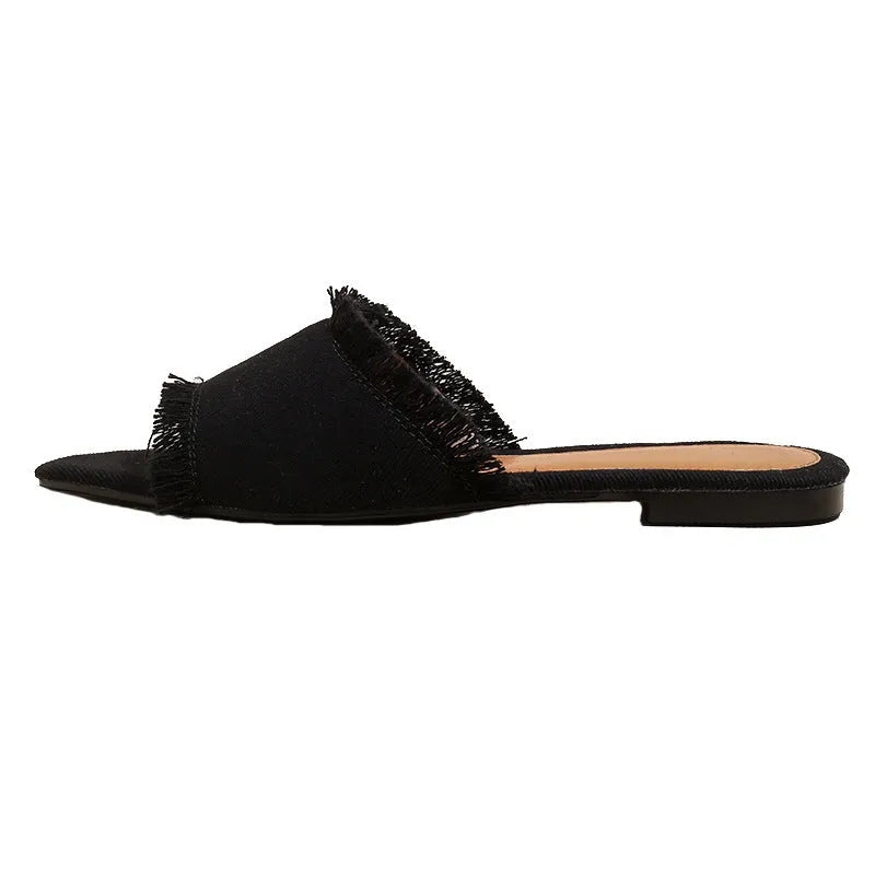 Women's flat denim slippers with a tassel detail and leather lining in apricot colour