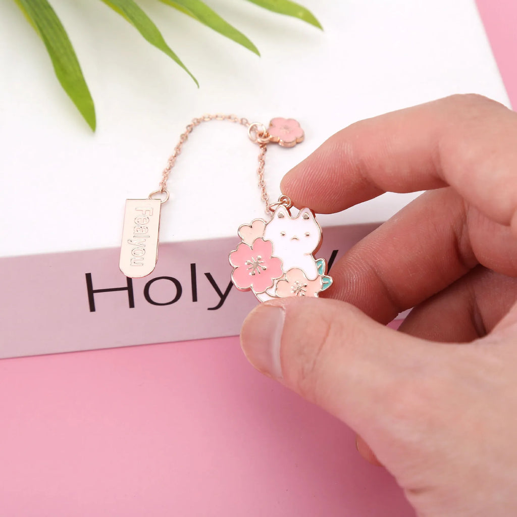 Creative cartoon metal pendant bookmark holder with cherry cat design.