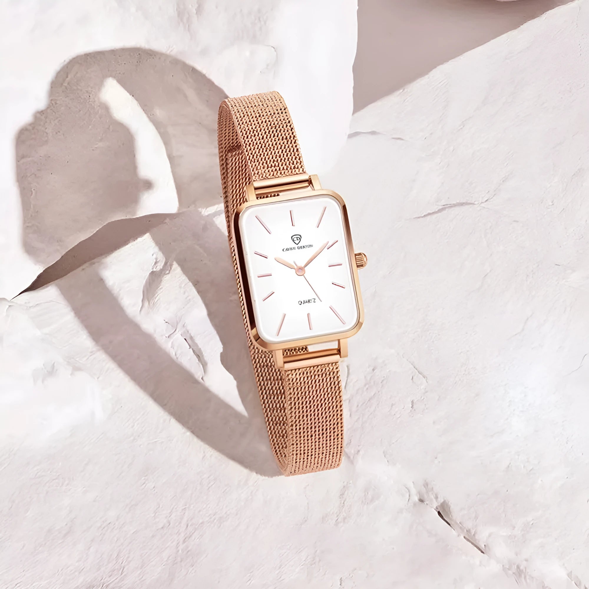 Women's waterproof quartz watch with 34mm alloy case and woven steel strap in rose gold colour