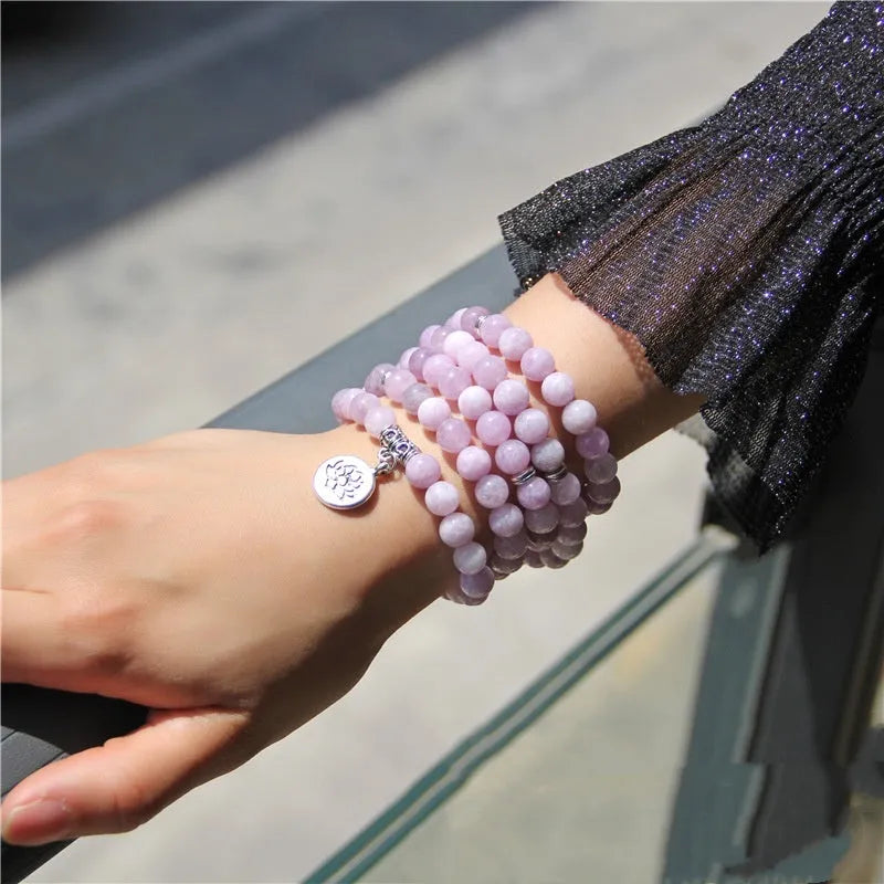 Women's bracelet with natural stone lotus pendant in geometric design showing eight colour variations