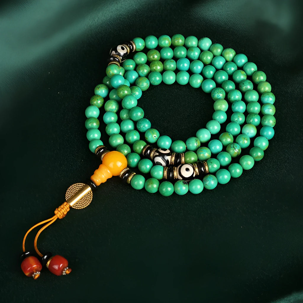 Natural raw turquoise bracelet with 108 round 8mm beads on a wrist, showing polished stone and national style design.