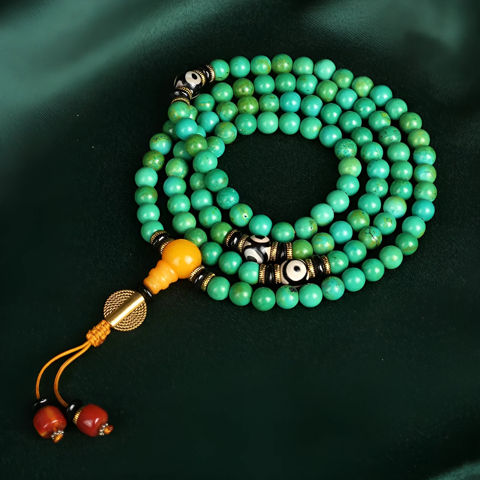 Natural raw turquoise bracelet with 108 round 8mm beads on a wrist, showing polished stone and national style design.