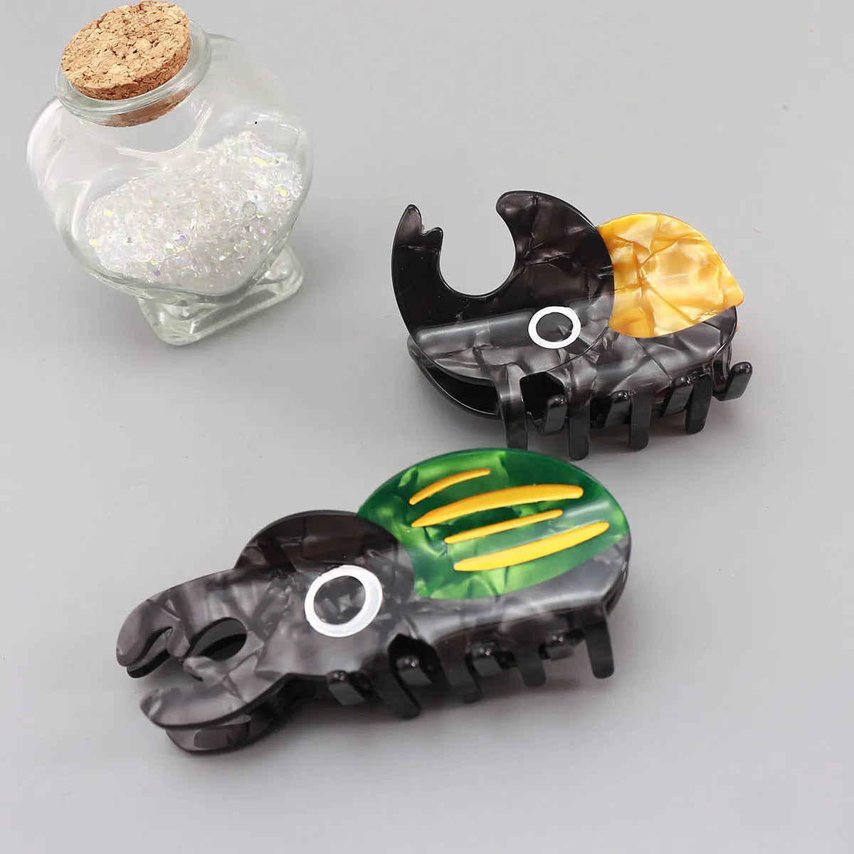 Handmade cellulose acetate insect beetle grip desk accessory with cartoon caterpillar design