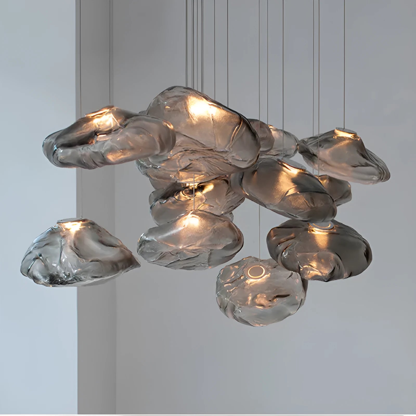Modern glass decorative chandelier with LED lighting in amber, clear or smoke grey colours