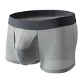 Men's solid colour ice silk boxer briefs with a low waist and mesh knit fabric.