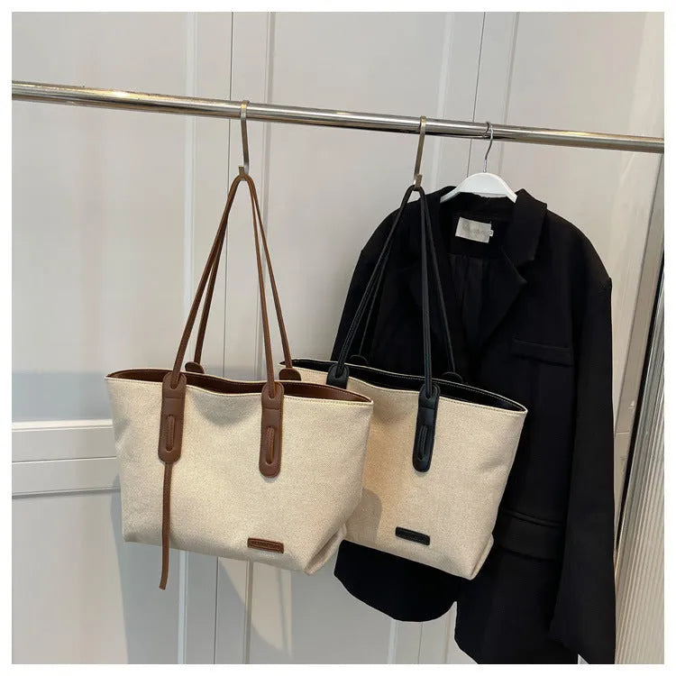 Shoulder bag in Oxford cloth with double straps, available in Black and Brown, size 46x32x27cm