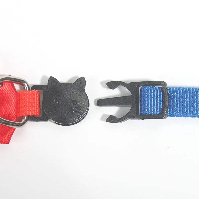 Adjustable striped nylon cat collar with a small bell, shown in multiple colour options on a white background.