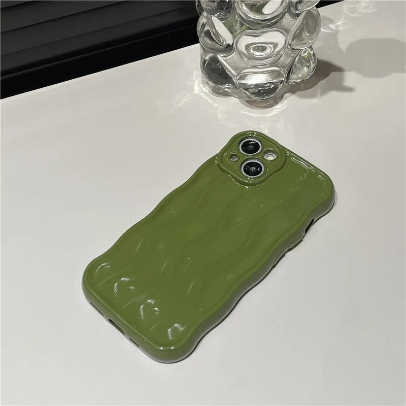 Silicone iPhone 17 phone case with water ripple texture in burgundy colour.