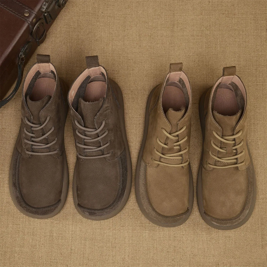 Women's grey genuine leather Martin boots with wedge heel and lace-up front.