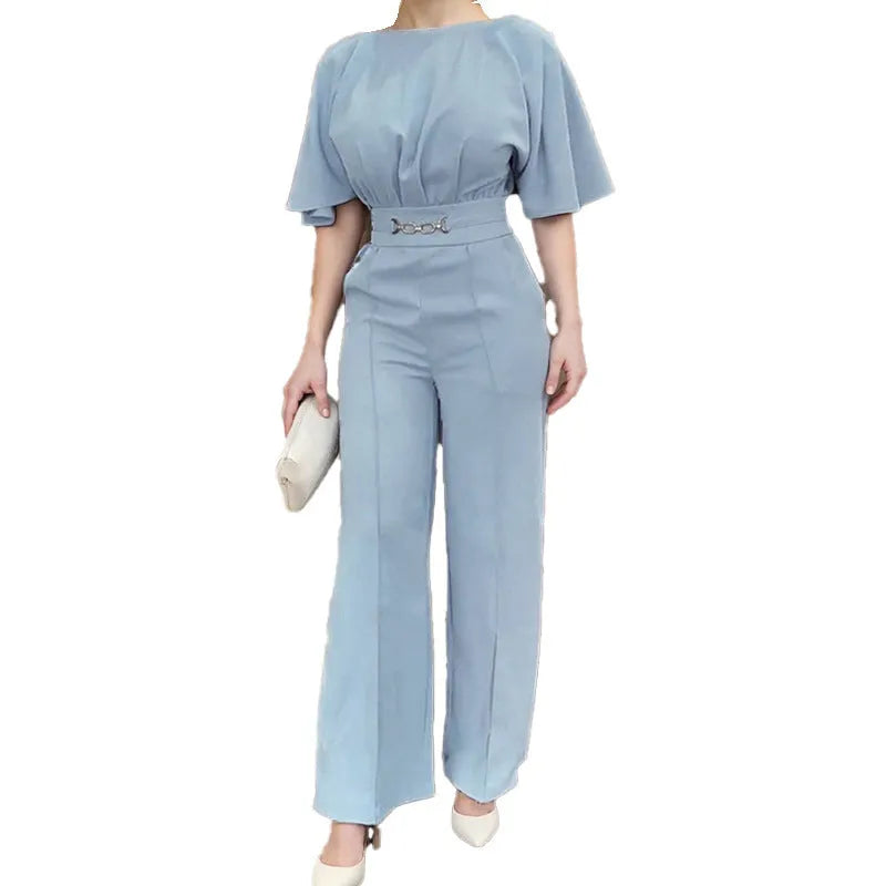 Blue polyester men's suit comprising trousers and a long-sleeve shirt, laid flat.