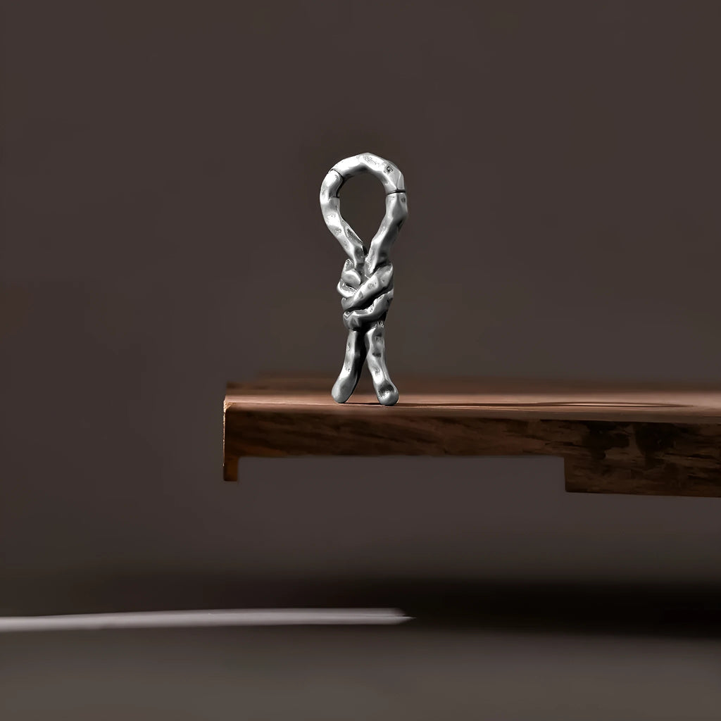 Close-up of a copper bending and connecting earring for cartilage piercing, 4mm in size.