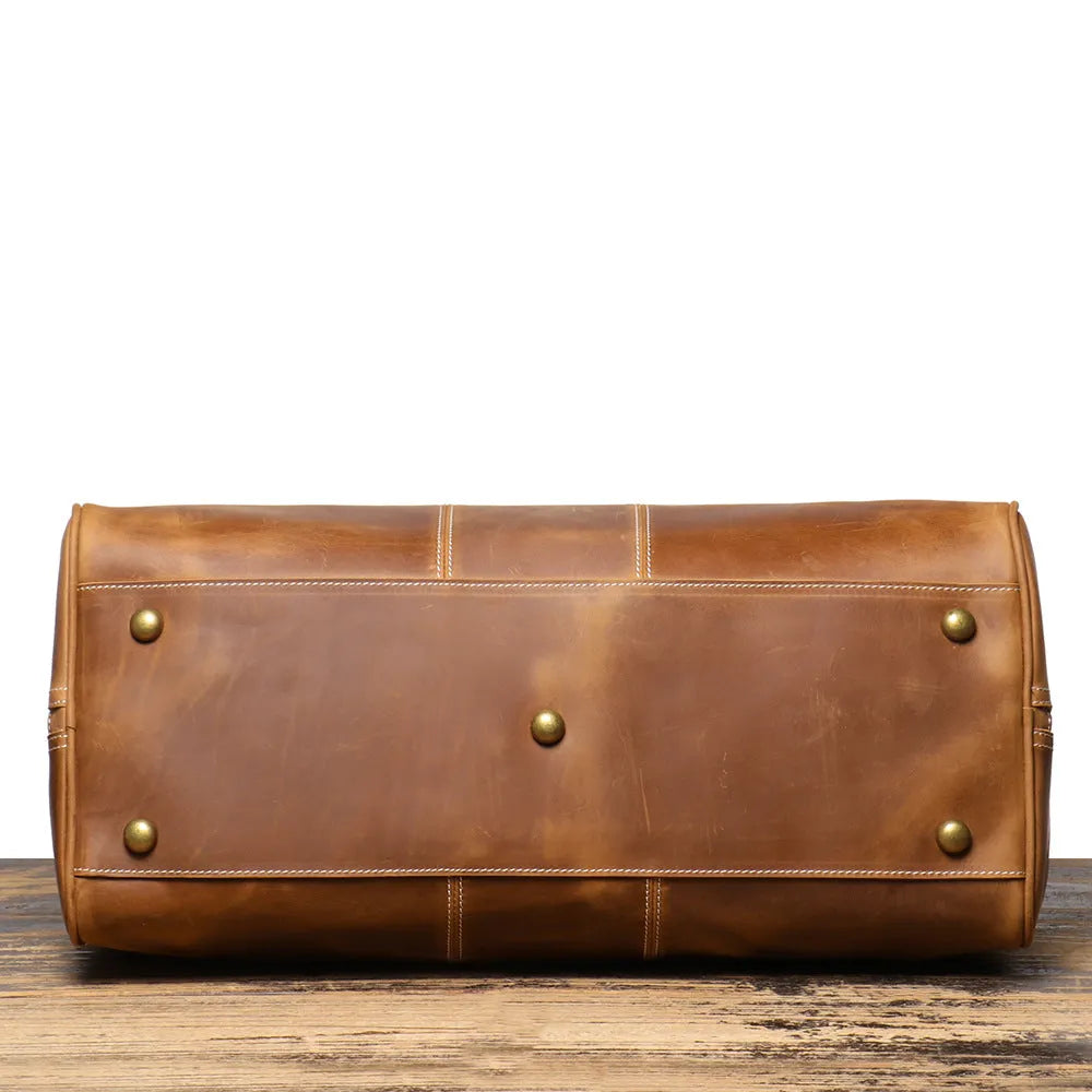 Retro genuine leather travel bag in vintage brown with sewing line detailing and shoulder strap
