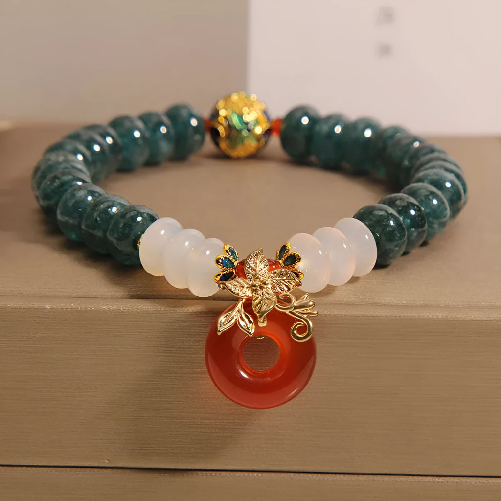 Blue water jade abacus bead crystal bracelet with red agate peace buckle and rhinestone details
