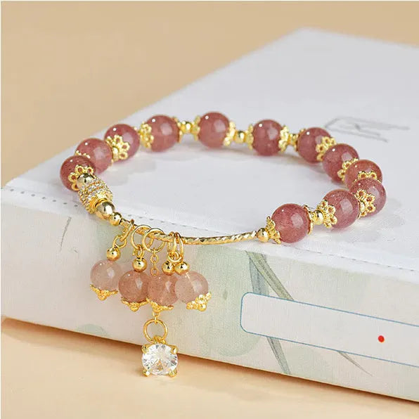 Pink adjustable women's bracelet with heart-shaped strawberry quartz crystal and freshwater pearl accents