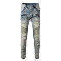 Light blue men's slim fit distressed jeans with hand-frayed detailing and a tapered leg.
