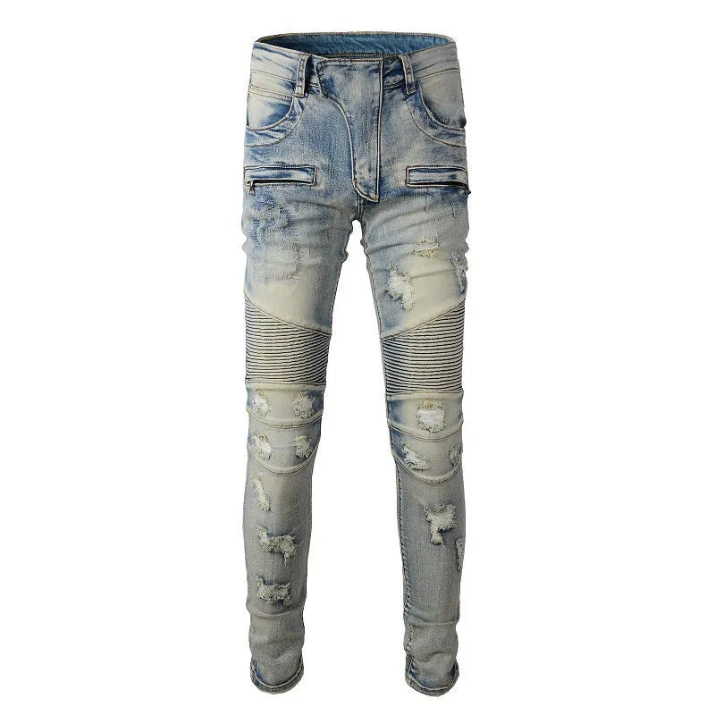 Light blue men's slim fit distressed jeans with hand-frayed detailing and a tapered leg.