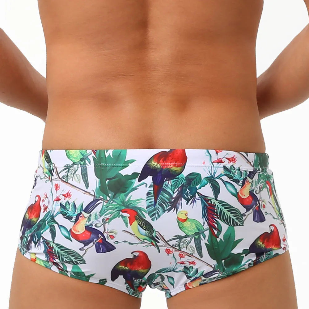 Men's floral and bird print nylon swimming trunks in boxer brief style.