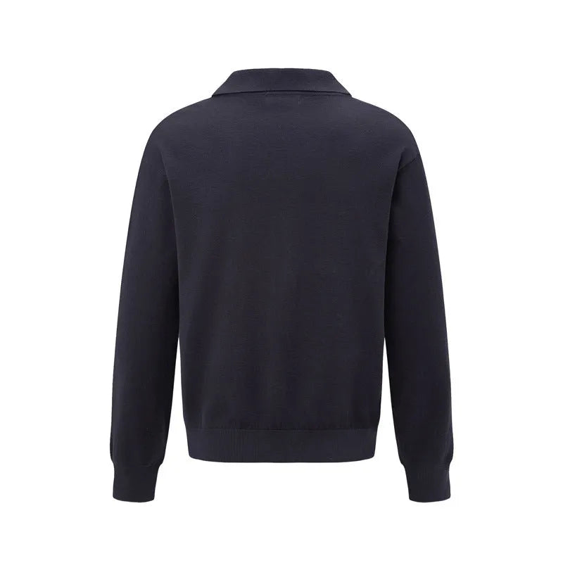 Loose fit black acrylic blend pullover sweater on a hanger.