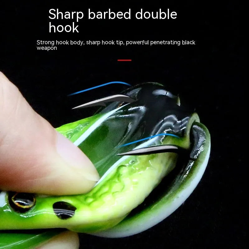 Bionic thunder frog snake head fishing lure in grass green with black yellow dots pattern and double hooks
