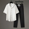 Men's national style two-piece sportswear set showing knitted half-sleeve top and full-length trousers