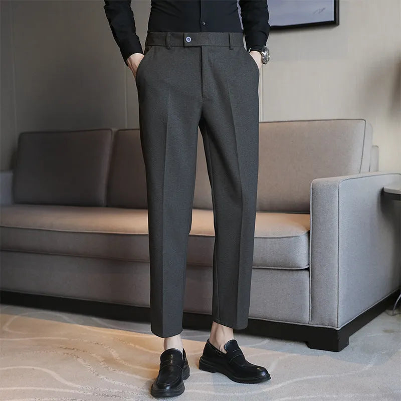 Retro brown straight leg corduroy trousers with elastic waistband laid flat.