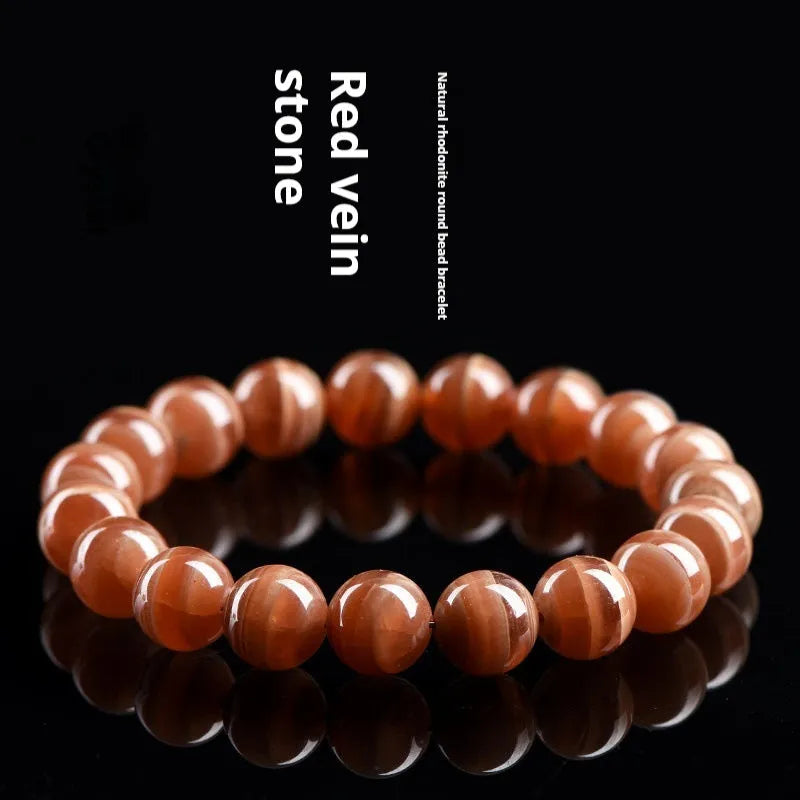 Natural old mine rhodochrosite round beads bracelet with manganese spar construction