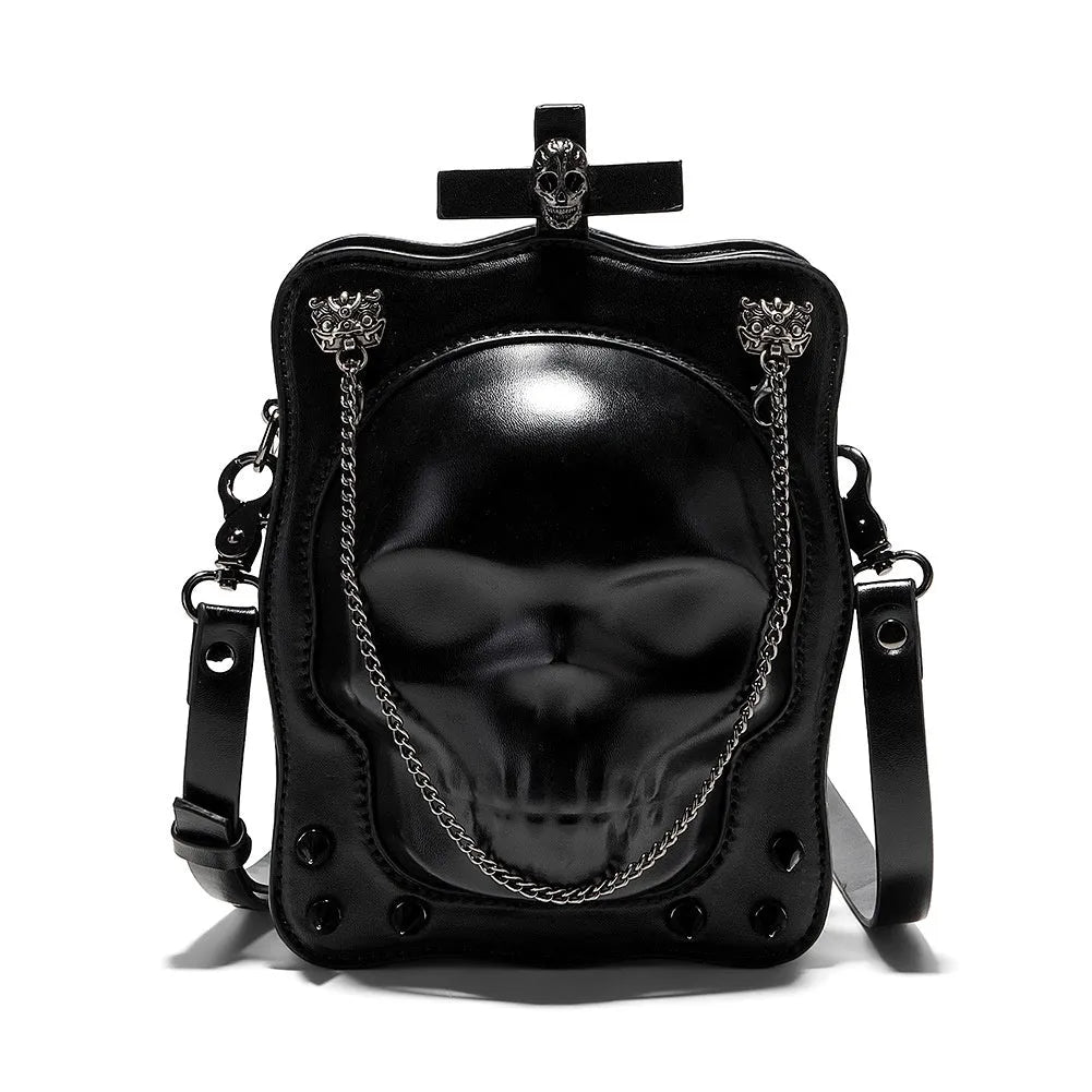 Black mini square crossbody bag with skull embroidery, decorative stitching, and metal chain details