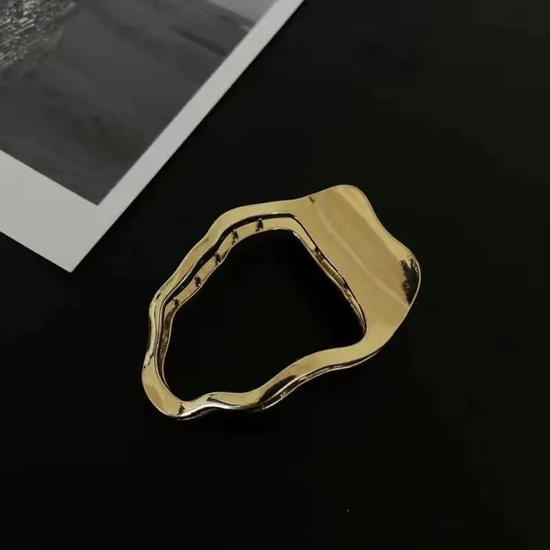 Gold and silver zinc alloy hair clips in arc, square, and triangle geometric shapes