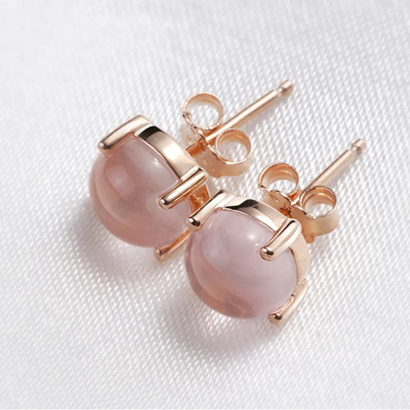 Rose gold drop shape stud earrings with synthetic Ross quartz crystal inlay