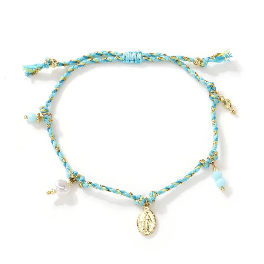 Close-up of a colourful hand-woven braided rope bracelet for women in ethnic style.