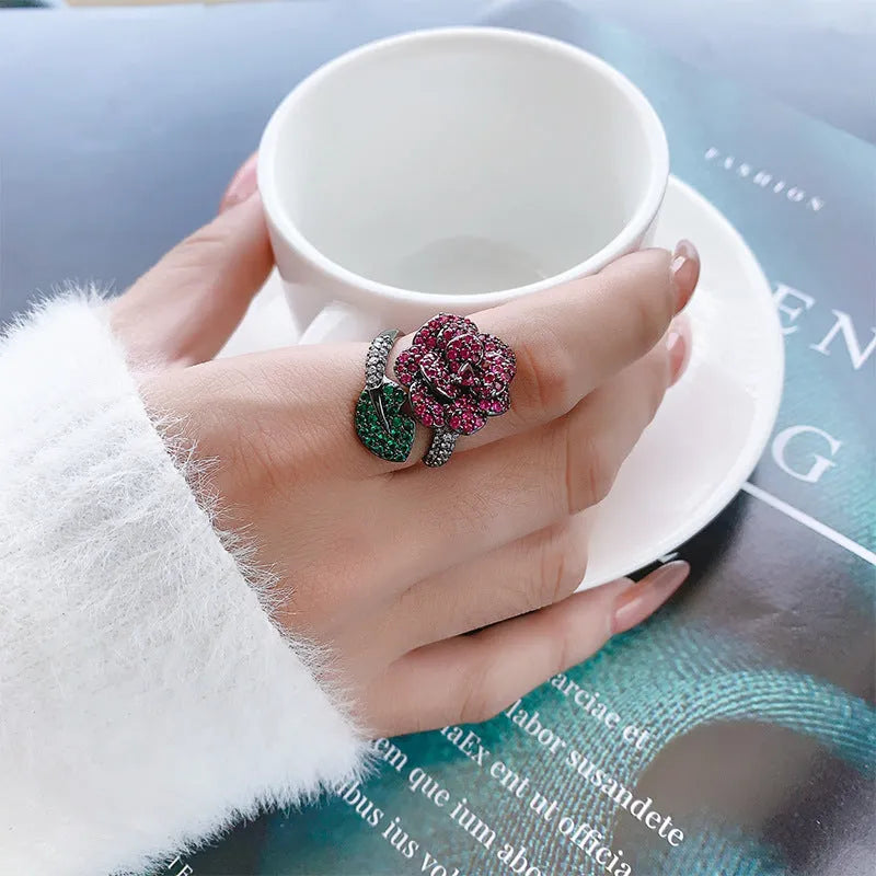 Women's black gold geometric flower personality ring with simulated red corundum stone