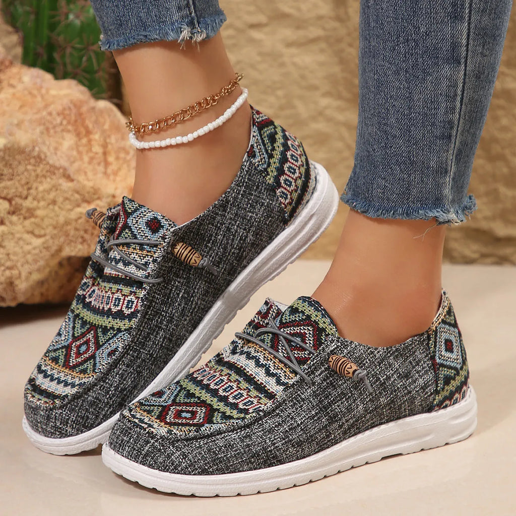 Women's flat round toe casual shoes in black, dark grey, or khaki with a low-top design and rubber sole.