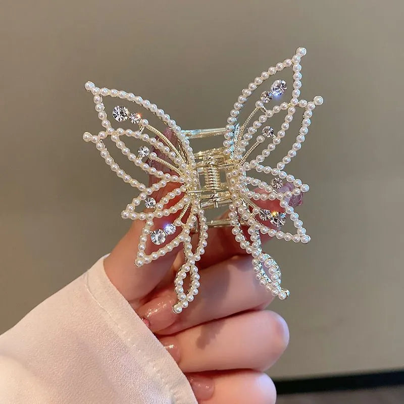 Butterfly-shaped hair clip for women in alloy metal with rhinestone or pearl decorative elements